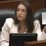 A photo of Alexandria Ocasio-Cortez during a congressional hearing.