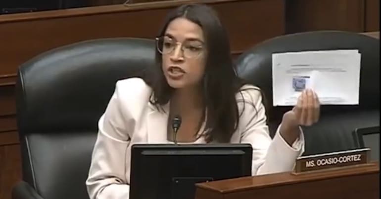 A photo of Alexandria Ocasio-Cortez during a congressional hearing.