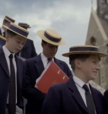 A rollercoaster pictured next to boys from the private school Harrow
