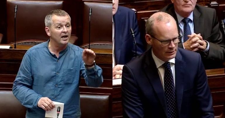 A photo of Richard Boyd Barrett and Simon Coveney in the Irish parliament
