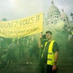Gilets jaunes protestesrs on the steps of Montmarte