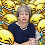 Theresa May surrounded by laughing emojis