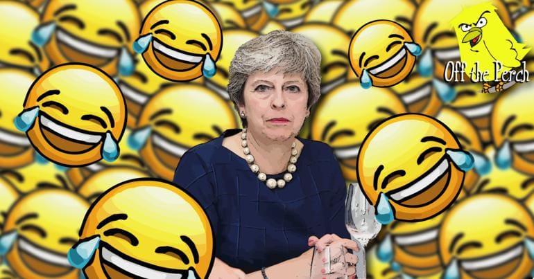 Theresa May surrounded by laughing emojis