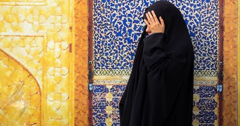 A Muslim woman hiding her face