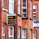 Townhouses with 'to let' signs