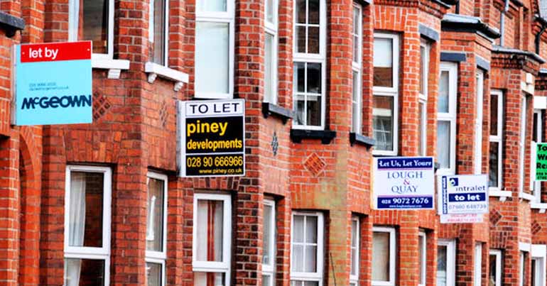 Townhouses with 'to let' signs