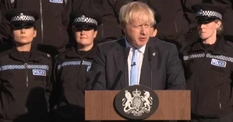 Boris Johnson making speech in front of police