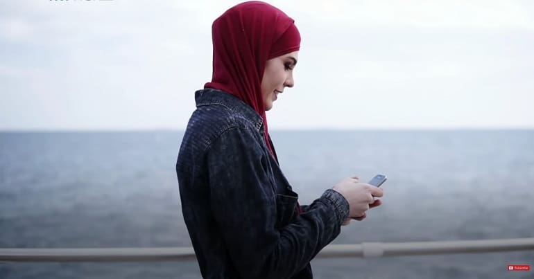 Muslim girl on phone