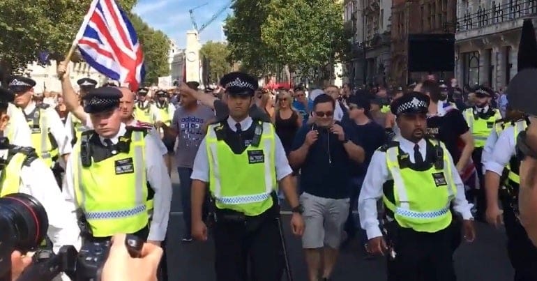 Police escorting counter protesters at 'stop the coup' protest in London on 31 August 2019