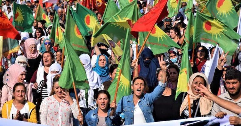 Women marching in Rojava