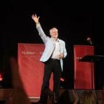 Jeremy Corbyn waving from the stage