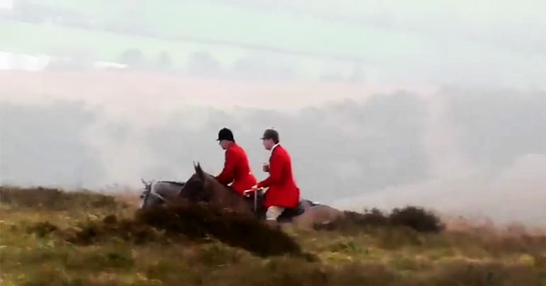 Two huntsman and hounds on Long Mynd