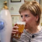Sturgeon sipping on a pint