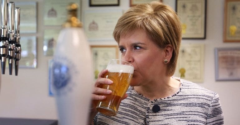 Sturgeon sipping on a pint