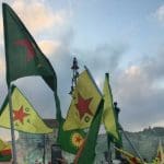 YPG flags fly at a protest in Hungary