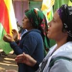 Women from Rojava's Jinwar village on a march