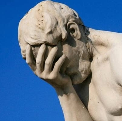 head-in-hand statue and screengrab of parody tweet