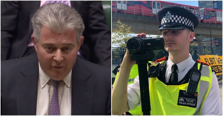 Brandon Lewis and police officer filming protest