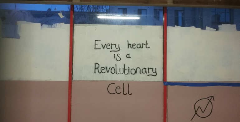 A slogan on the wall of one of DIY Kodak Collective's night shelters 