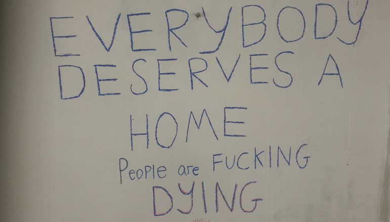 A slogan on the wall of one of DIY Kodak Collective's night shelters 