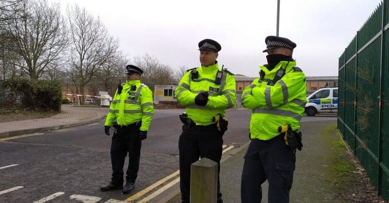 Three coppers stand outside of Belmarsh prison grounds