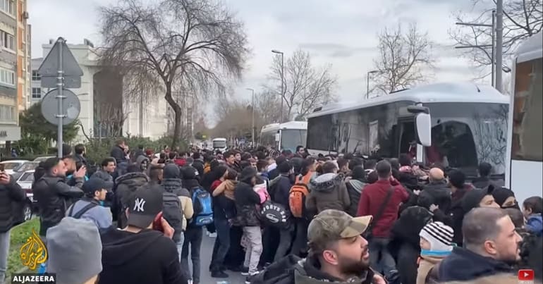 Refugees bording bus
