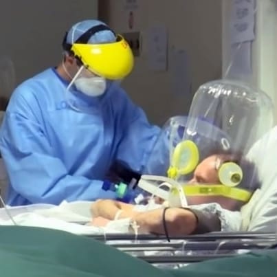 Doctors treat a coronavirus patient in Italy