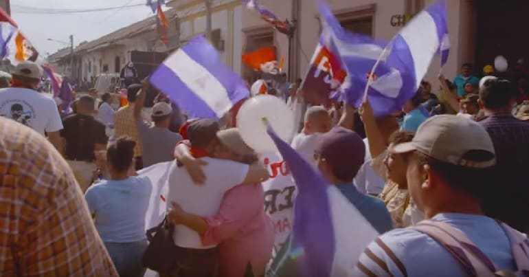 People in Nicaragua waving flags