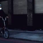 Man in face mask on bike