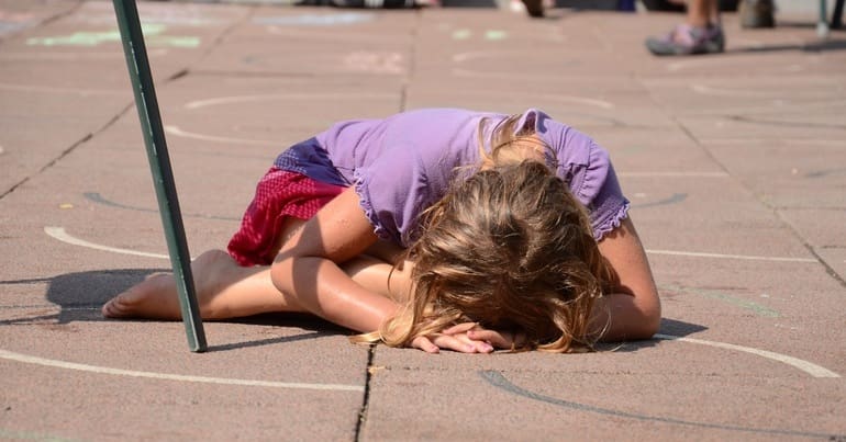 Girl lying down in playgorund