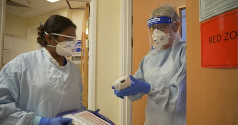 Hospital staff wearing personal protective equipment (PPE)