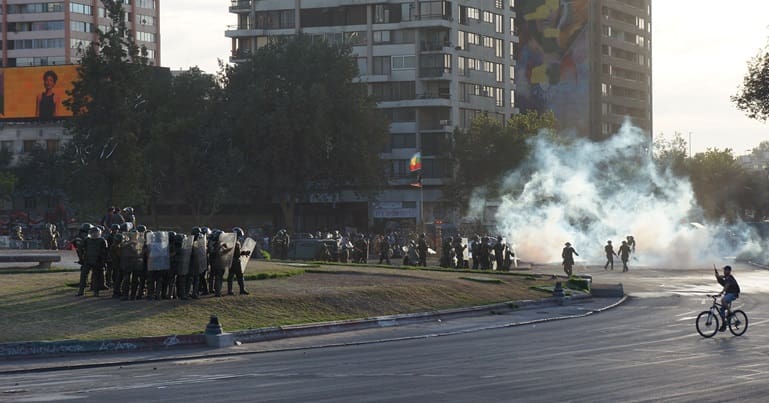 Chilean police firing tear gas at protesters
