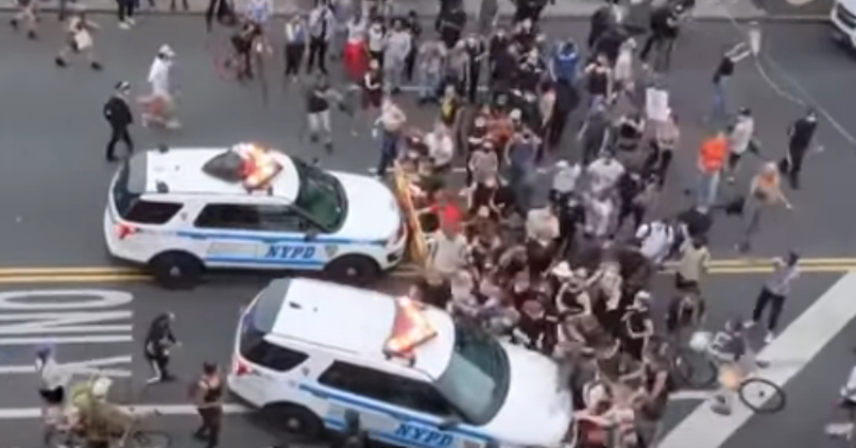 US police drive into protesters