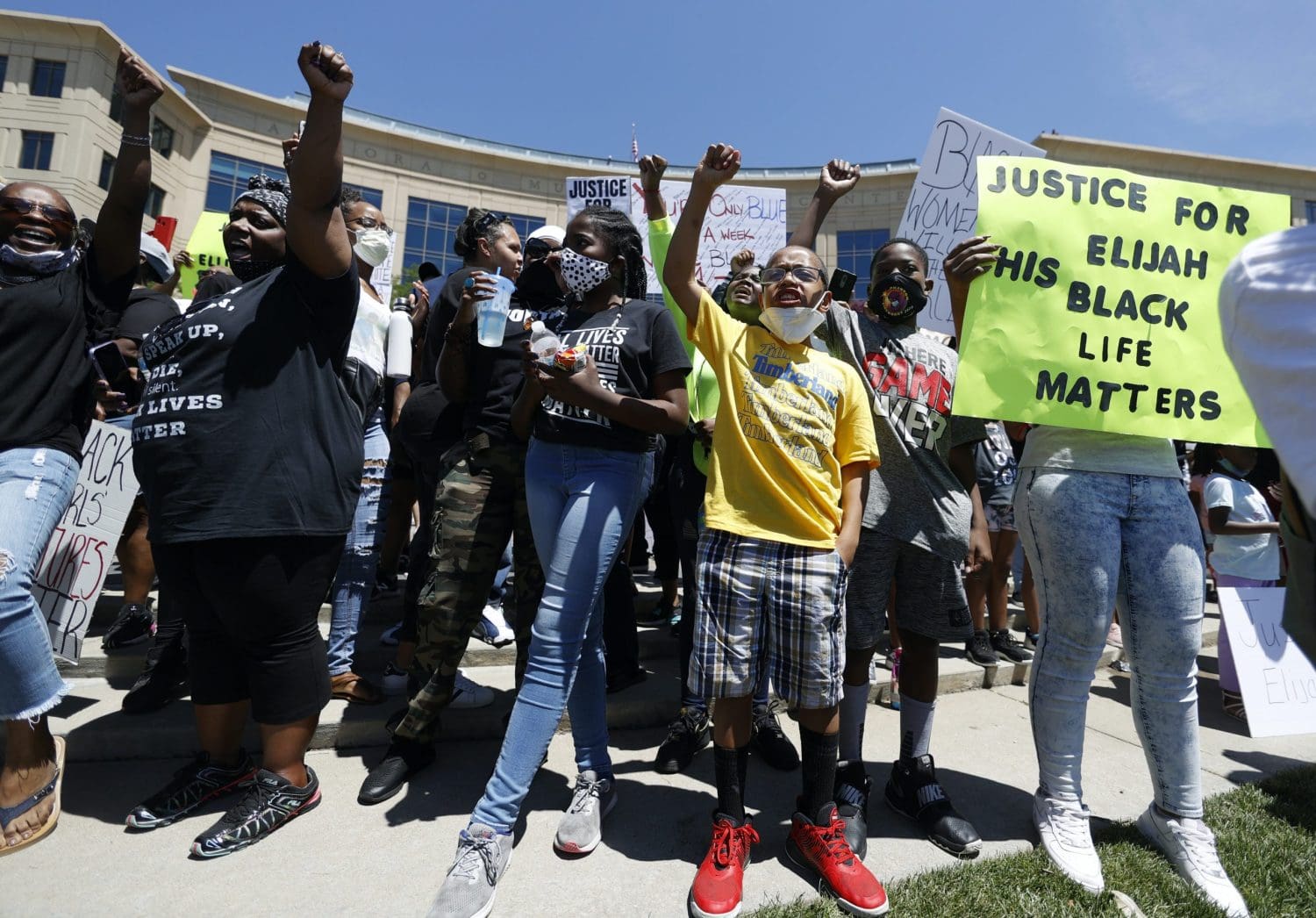 Protesters holding Black Lives Matter signs