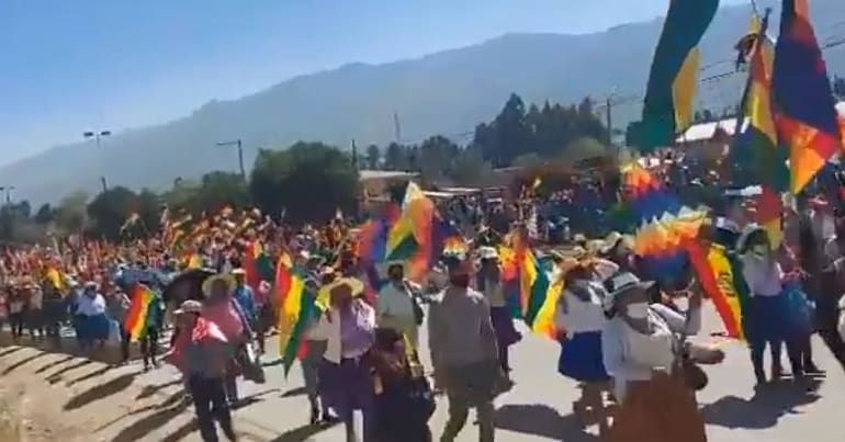 Bolivians march past the Huayllani bridge, Sacaba, as part of a mass mobilisation