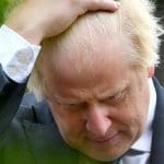Boris Johnson scratching his head
