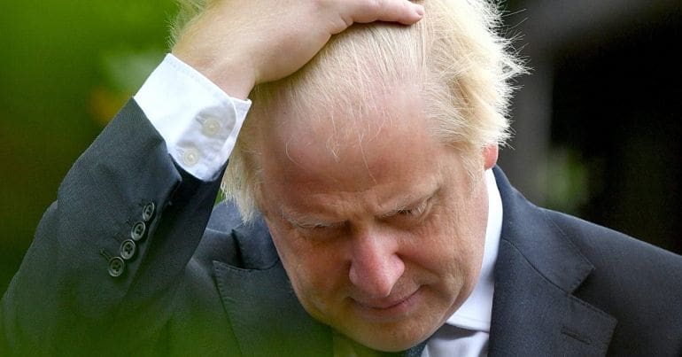 Boris Johnson scratching his head