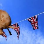Union Jack Bunting with a dog metaphorically pooing on Brexit