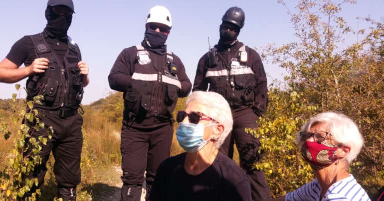 Protesters face off with police at the Calvert Jubilee Nature Reserve