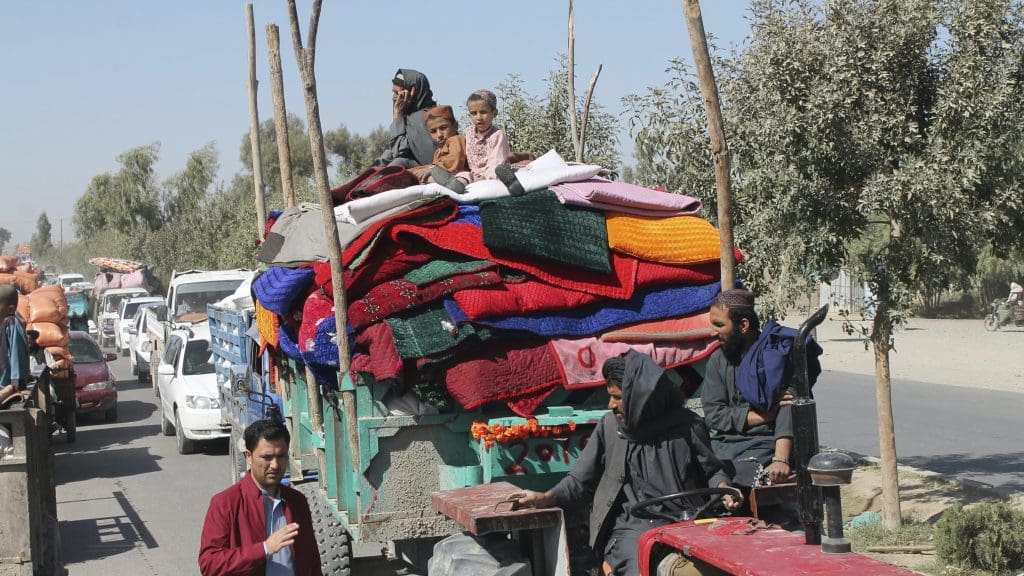 People in Afghanistan on a tractor