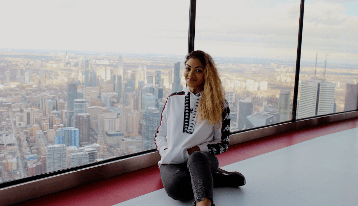 The author Aaliyah Harris at the top of a skyscraper