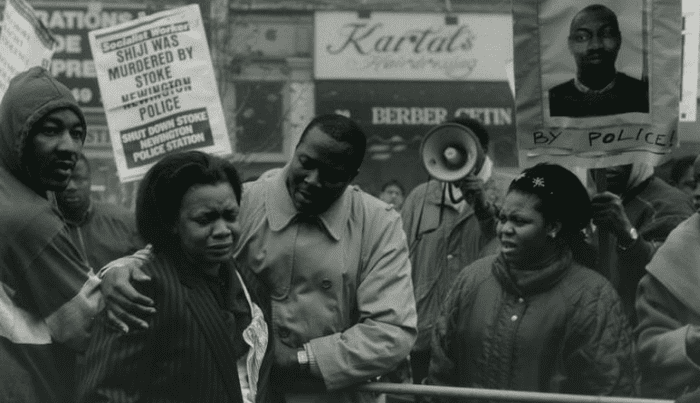 Black protesters comforting an upset woman