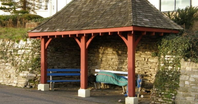 A rough sleeper on a bench