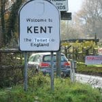 A road sign which reads 'Welcome to Kent: The toilet of England'