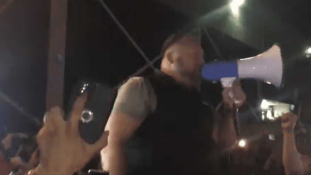 Alex Jones with a megaphone