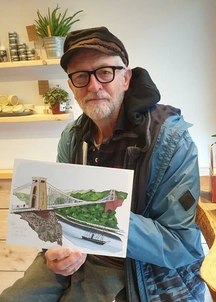 Jeremy Corbyn holding a painting 