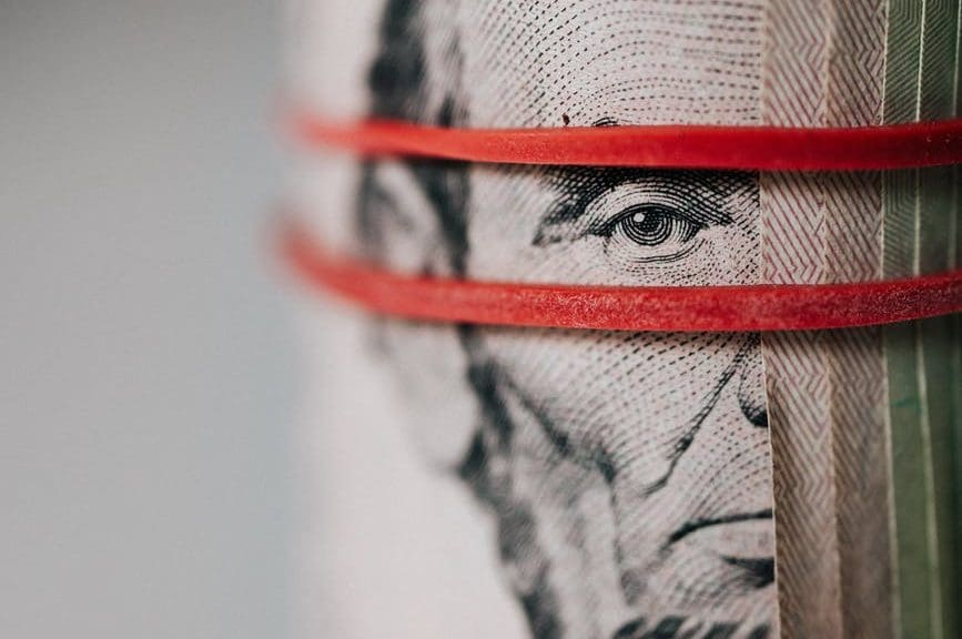 A rolled up dollar bill
