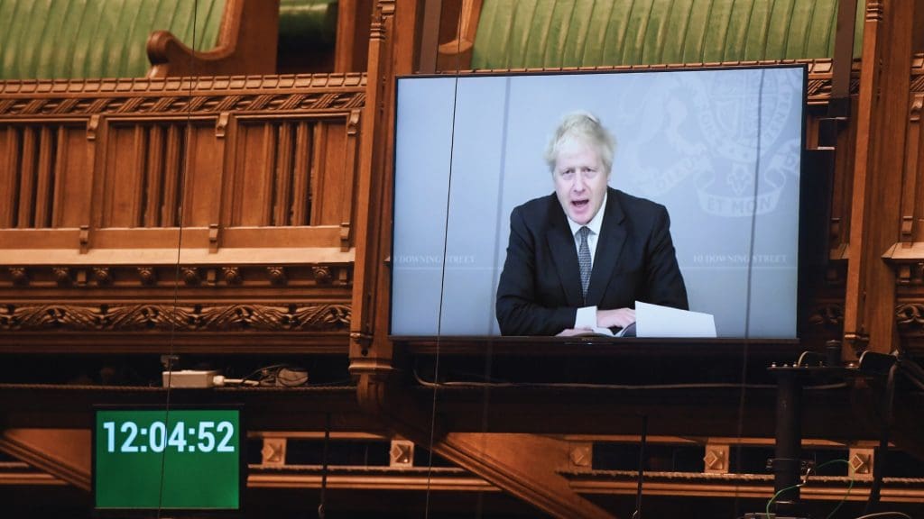 Boris Johnson being broadcast onto a screen in parliament