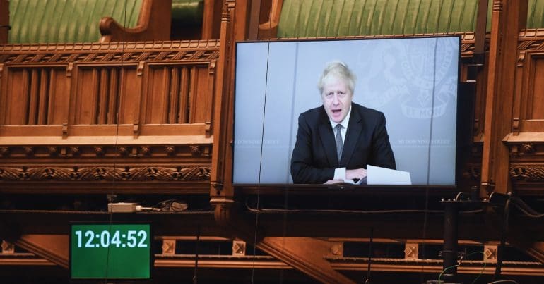 Boris Johnson being broadcast onto a screen in parliament