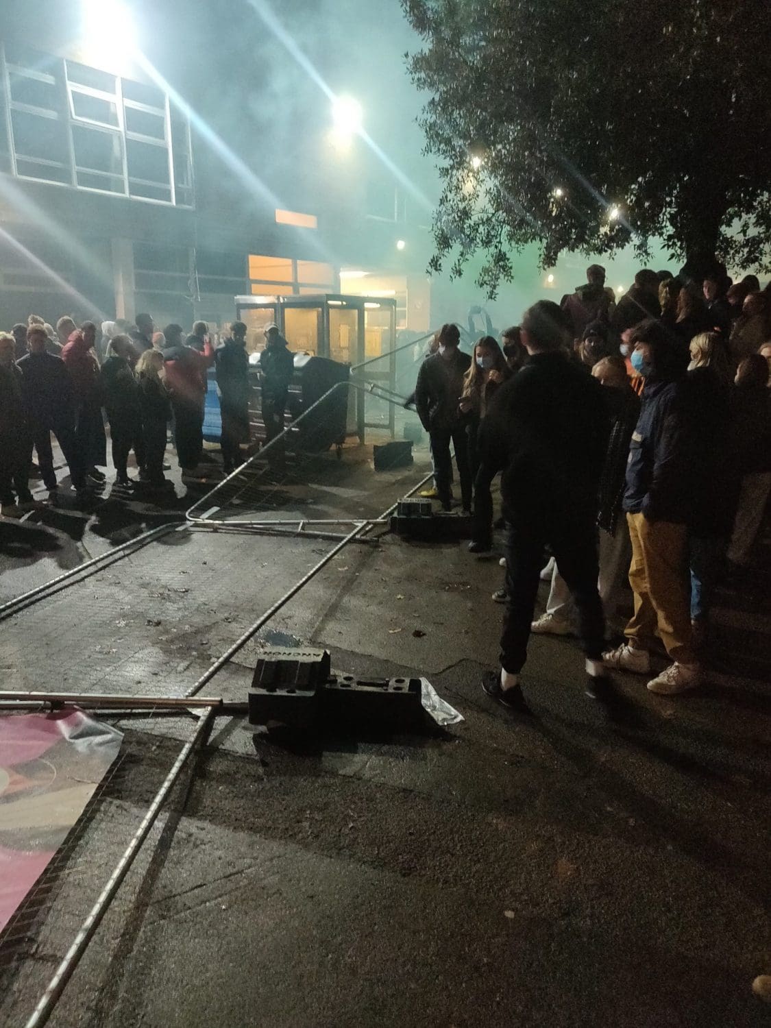 Protesters in the aftermath of tearing down the fence